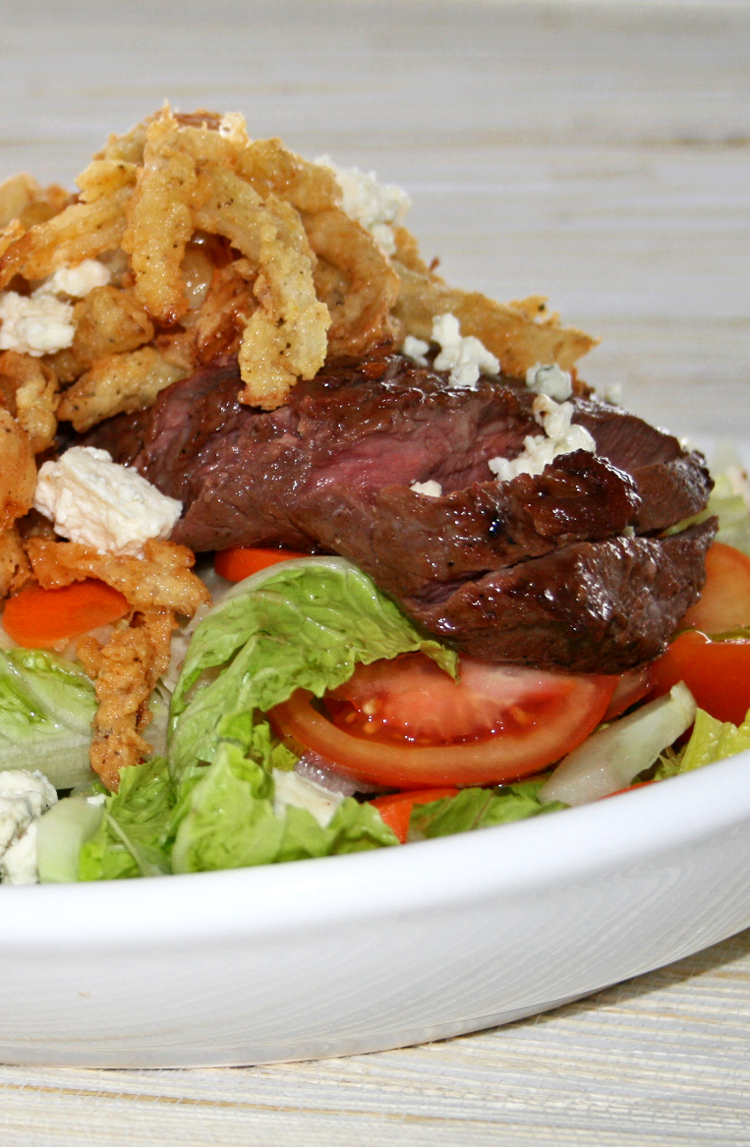 Steak Salad with Blue Cheese Crumbles and Onion Strings